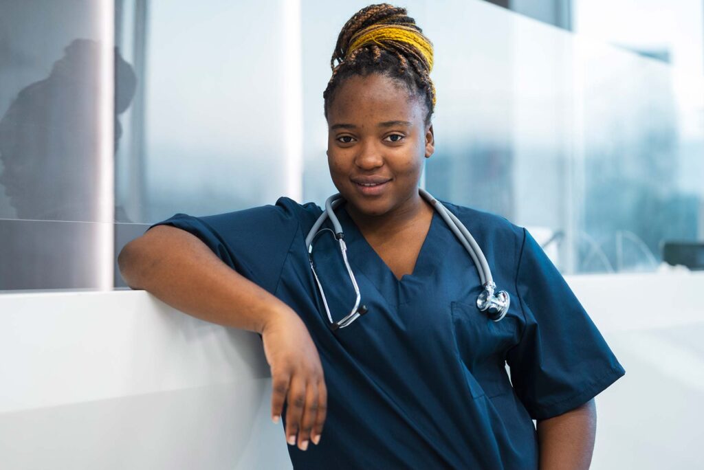 Front view smiley nurse with stethoscope